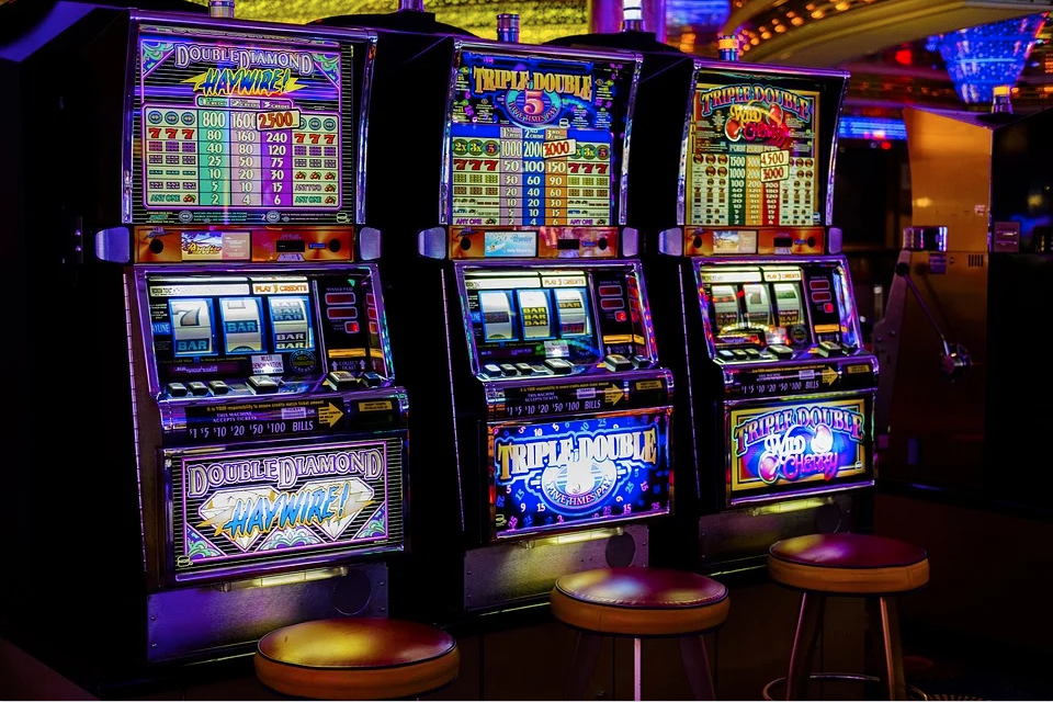 three slot machines in a casino